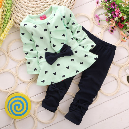 Two-Piece Pants and Shirt Ensemble with Heart Pattern and Bow Detail on the Front of the Shirt